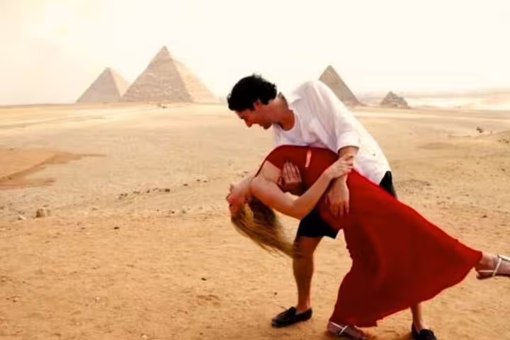 Couple posing by the Giza Pyramids in Cairo, a highlight of the Port Said shore excursion tour