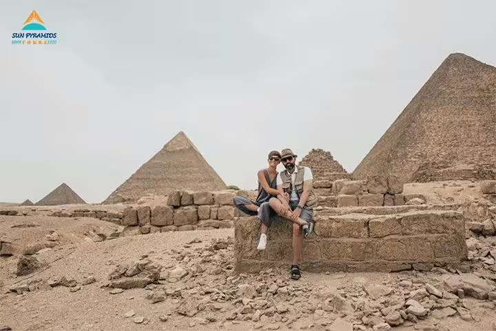 Couple at Giza Pyramids, Cairo on 12 day 11 night Egypt package tour to Luxor, Aswan and Hurghada