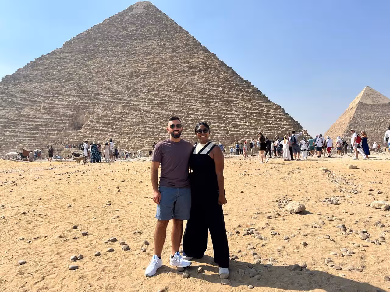 Couple photo at the Great Pyramid of Giza in Cairo, a highlight of the camel ride and lunch tour