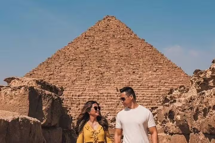 Couple at the Great Pyramid of Giza on a private shore excursion from Port Said to pyramids and museum