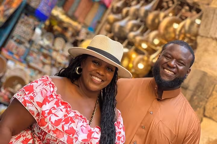 Smiling couple shopping at Khan el-Khalili market, a highlight of Cairo hidden gems culture, cuisine and Nile tour