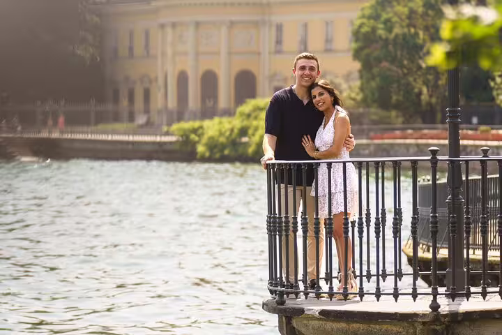 Couple hugging on a Lake Como pier by the water, photographed during a private personal travel photographer tour