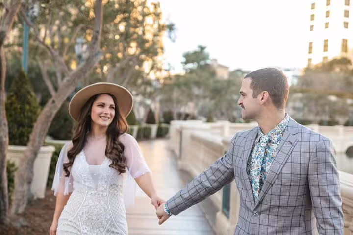 Couple holding hands on the Las Vegas Strip, captured during a personal travel and vacation photographer tour