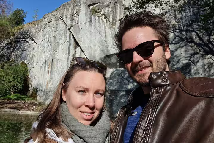 Couple selfie by rocky lakeshore near Lucerne on a self-guided scavenger hunt and sights walking tour