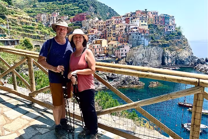 Couple enjoying scenic view of Manarola, Cinque Terre, during a private day trip from Florence.