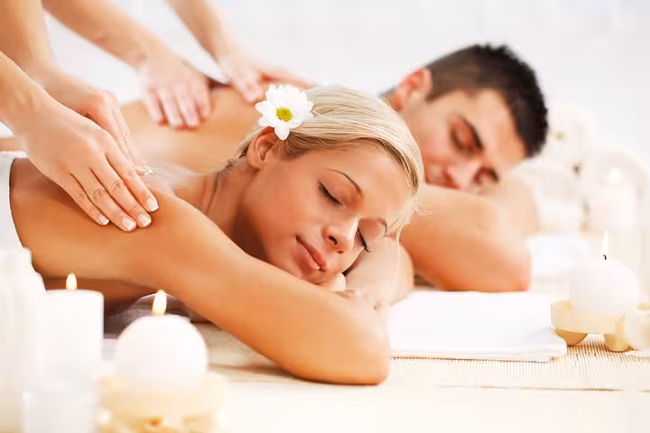 Couple enjoying relaxing full-body massage with candles at Sharm El Sheikh hammam spa experience