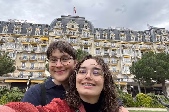 Couple selfie at Montreux Palace on a self-guided scavenger hunt and sights tour on Lake Geneva, Switzerland