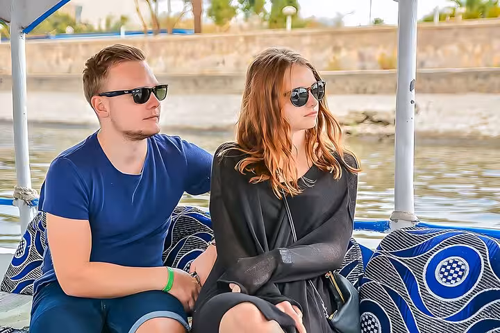 Couple relaxing on a Nile River boat in Luxor on a Cairo to Luxor small-group flight day tour