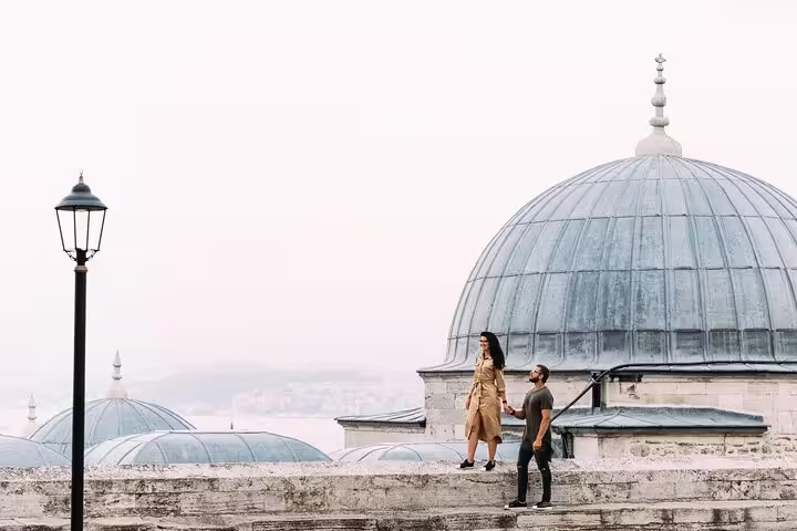 Couple posing by Ottoman mosque domes in Istanbul, captured on a private personal travel photographer tour