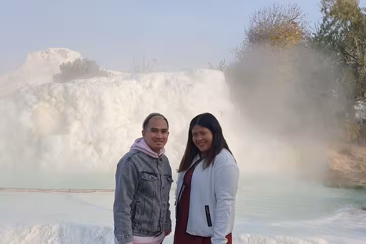 Couple at Pamukkale travertine terraces and thermal pools on 7 day 6 night express Turkey tour