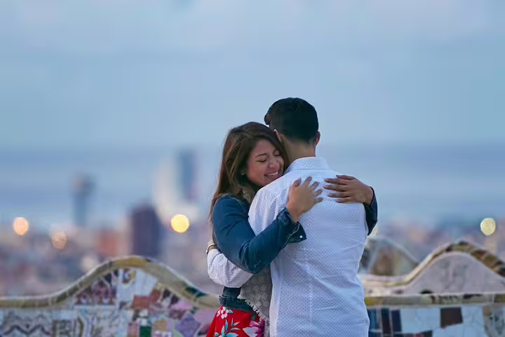 Couple hugging at Park Güell viewpoint, captured by personal travel photographer on private Barcelona tour