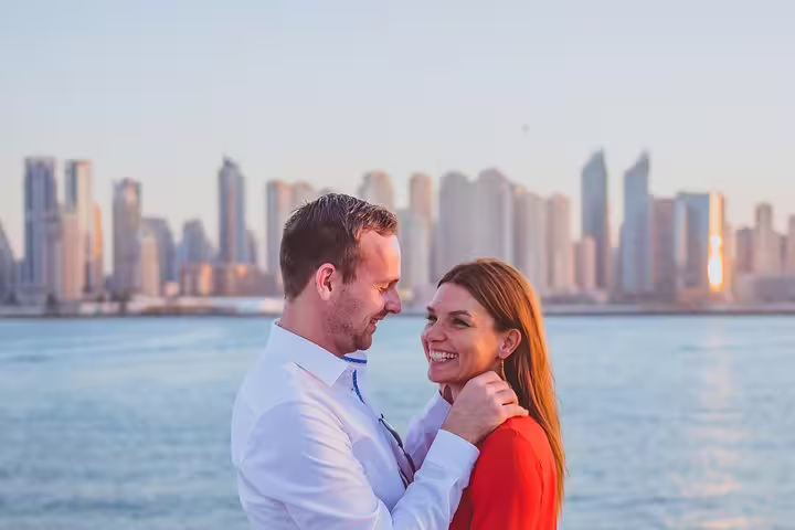 Couple photo shoot with Dubai Marina skyline backdrop on private tour with personal travel photographer