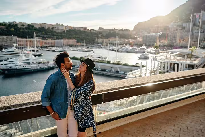 Couple posing at Port Hercules marina on a private Monaco travel photographer tour at golden hour