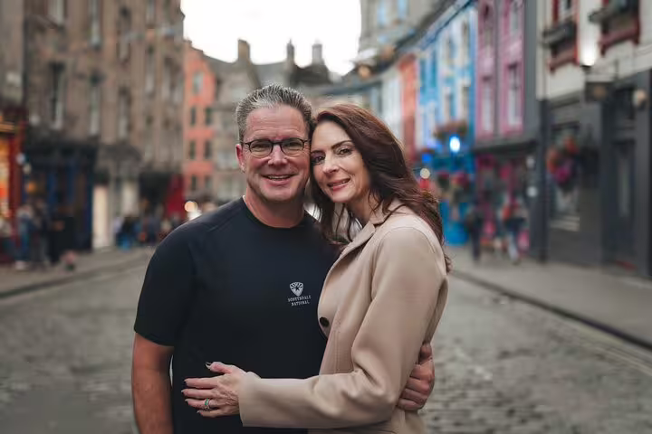 Couple portrait on Victoria Street, Edinburgh, captured in a private photoshoot with a professional photographer