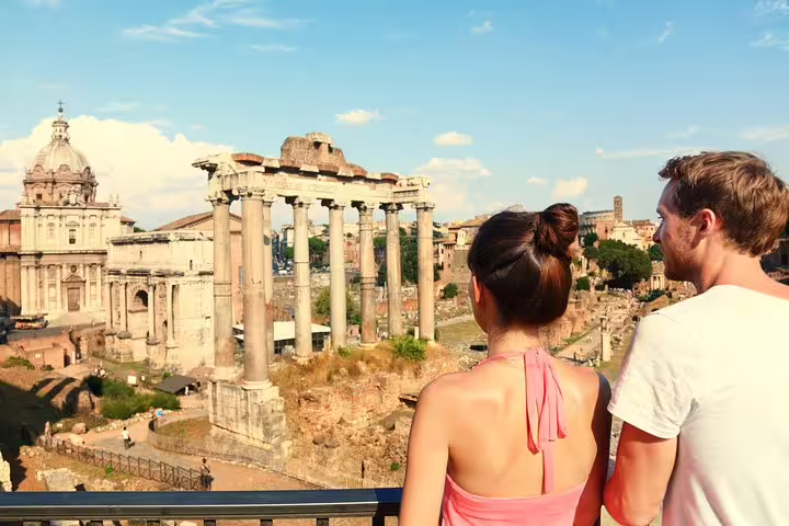 Couple overlooking Roman Forum ruins during Rome Colosseum and catacombs underground tour with guided transfer included