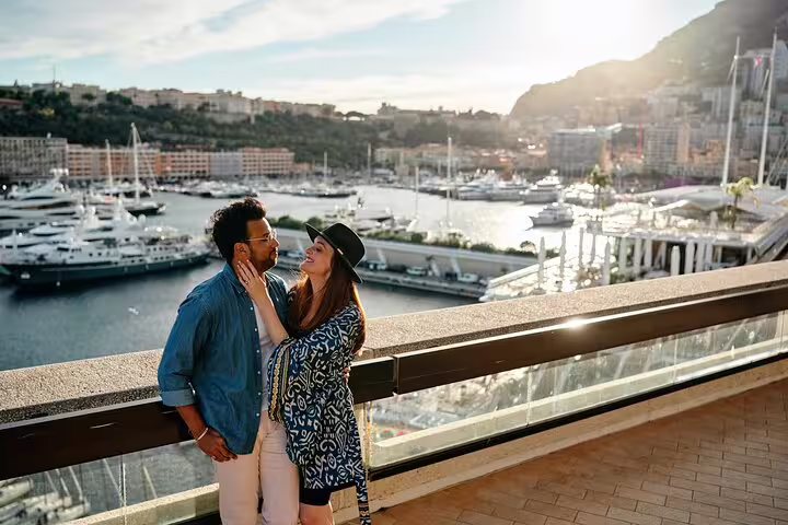 Couple enjoying a romantic moment with a stunning view of Nice marina during a private photographer tour.