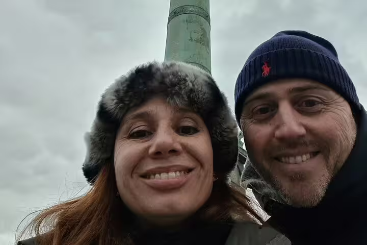 Smiling couple selfie in Paris during Marais District scavenger hunt and self-guided walking tour