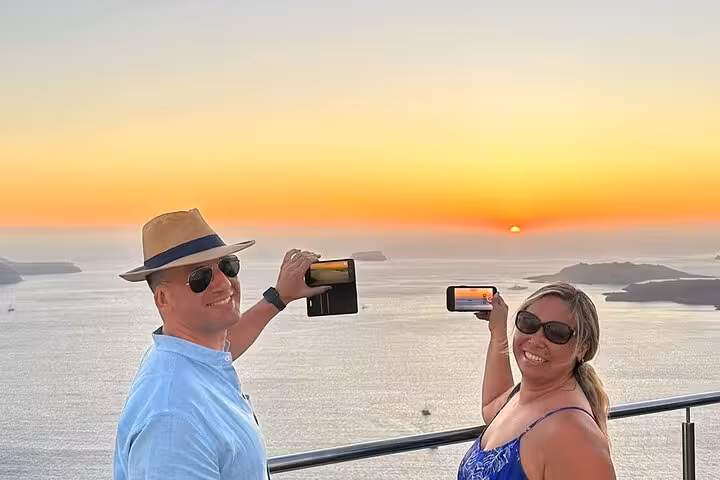 Couple enjoying golden-hour views while filming on a private sunset wine tour with 3 wineries and tapas