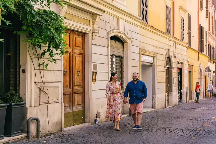 Couple strolling a charming Trastevere street in Rome, photographed on a private personal 3-hour photo tour