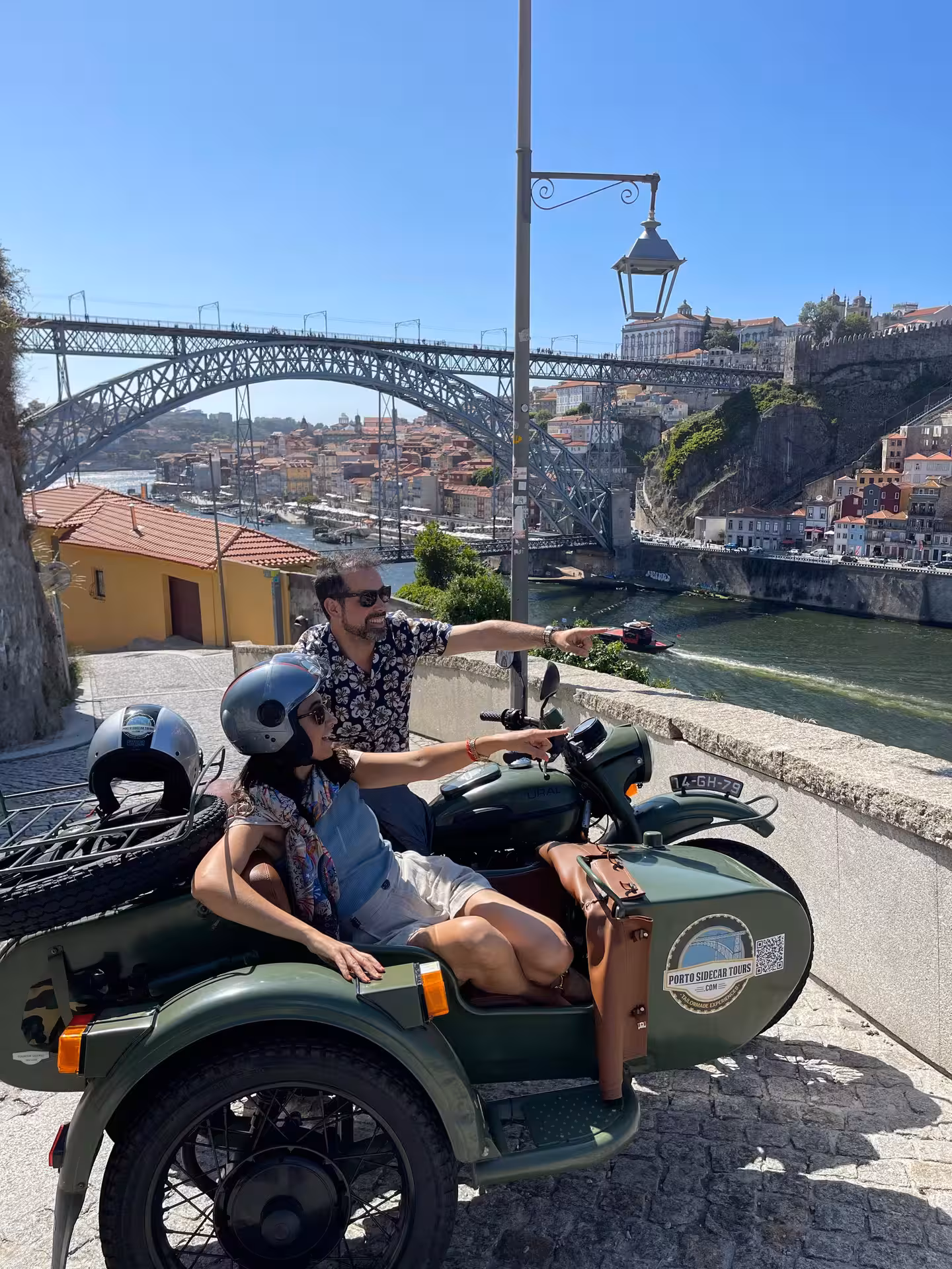 Couple in a vintage sidecar with Dom Luís I Bridge views, a fun Not Port! wine tour experience in Porto