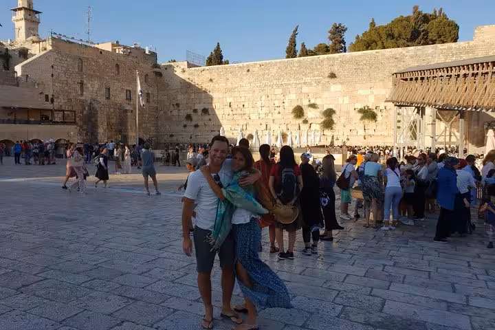 Couple posing at the Western Wall Plaza during Jerusalem private day tour from Tel Aviv, Old City highlights