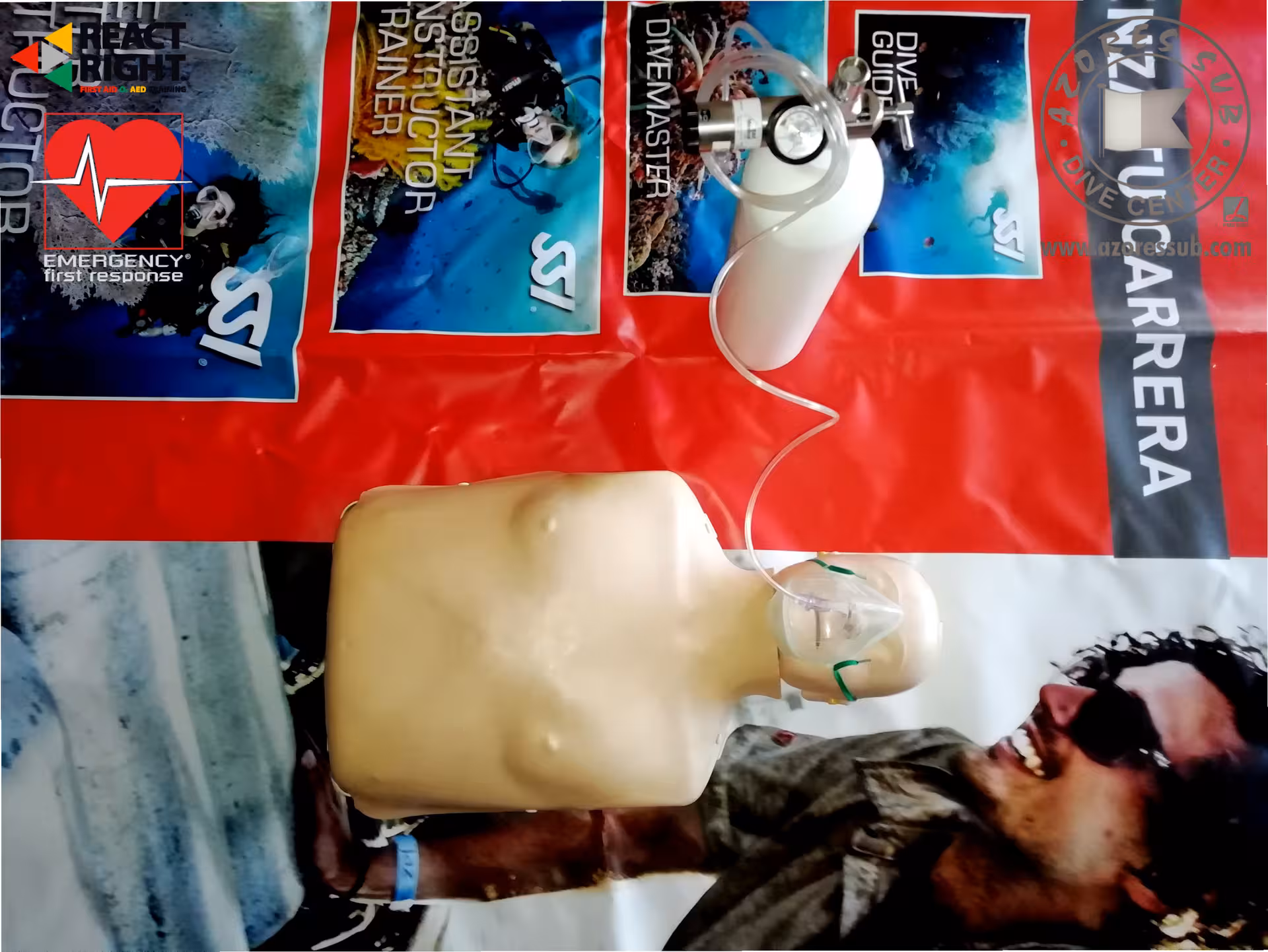 CPR training manikin with oxygen mask and regulator setup, used for first aid and O2 provider course practice
