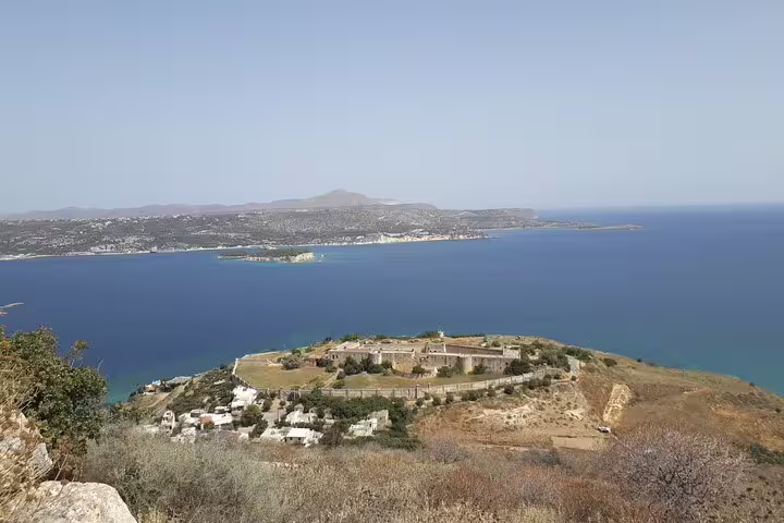 Panoramic view of a Cretan coastal fortress overlooking the deep blue sea, showcasing Chania's captivating seascape.