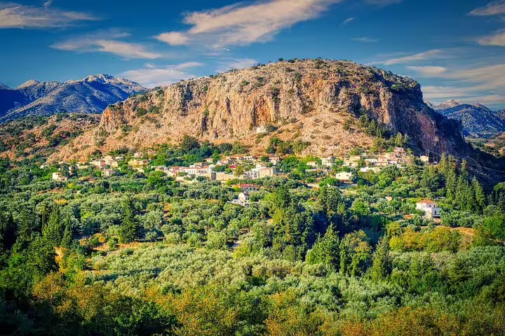 Scenic view of a lush valley and rocky hills on the Paths of Old Cretan Life tour near Chania.