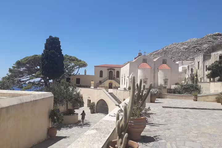 Explore the historic architecture of Crete's south coast with a serene courtyard view on a private tour from Chania.