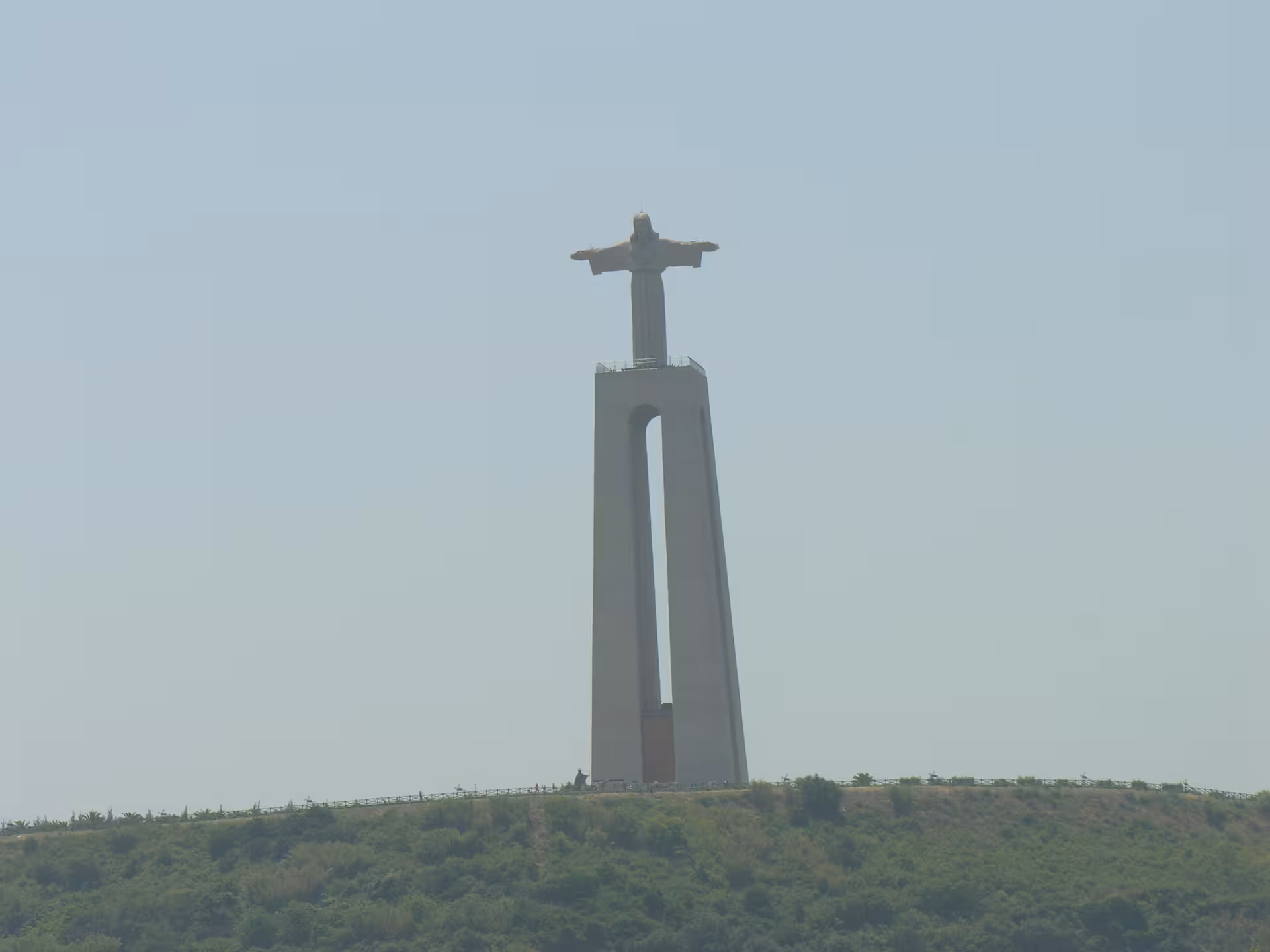 Cristo Rei statue in Almada seen from a private Lisbon sightseeing cruise on the Tagus River
