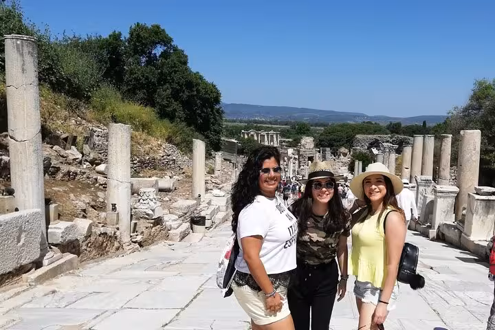 Cruise travelers on Curetes Street in Ephesus ruins, guided Biblical Ephesus tour from Kusadasi port