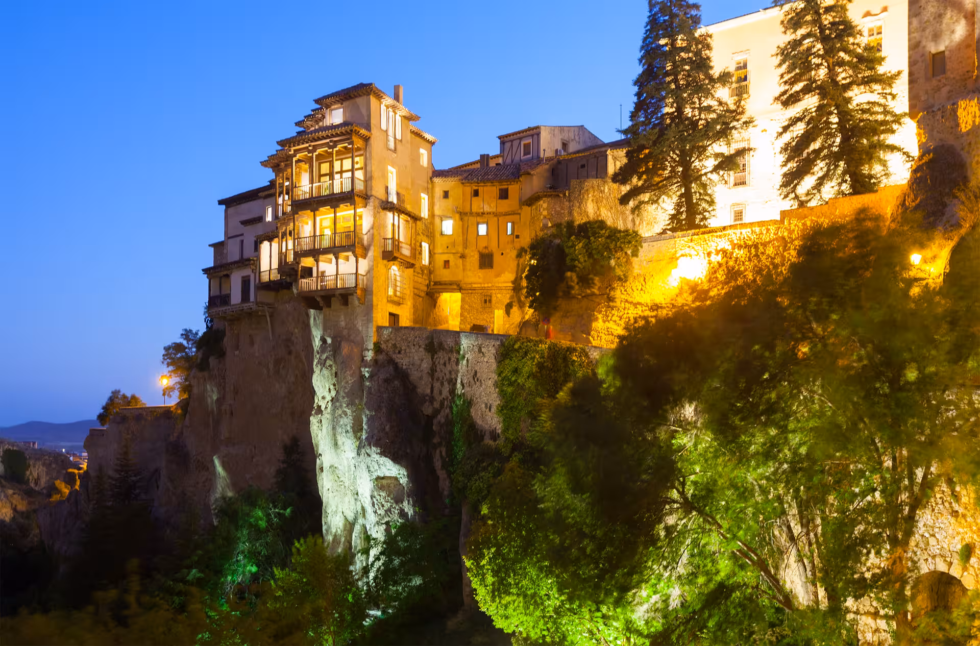 Cuenca Hanging Houses at dusk, cliffside views on Cuenca and Enchanted City day tour from Madrid