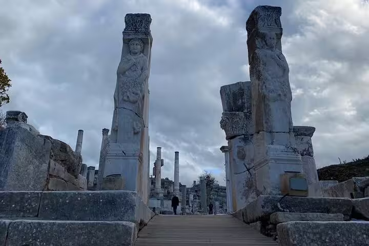 Curetes Street statues and ancient columns in Ephesus on a private tour from Kusadasi, Turkey