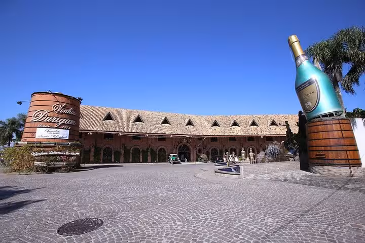 Explore Curitiba's iconic wine cellar with its grand architecture and giant bottle sculpture on our full-day city tour.