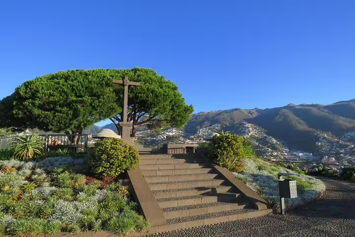 Scenic view of Curral das Freiras with lush greenery and mountain backdrop, ideal for 4WD Peaks Tour in Madeira.
