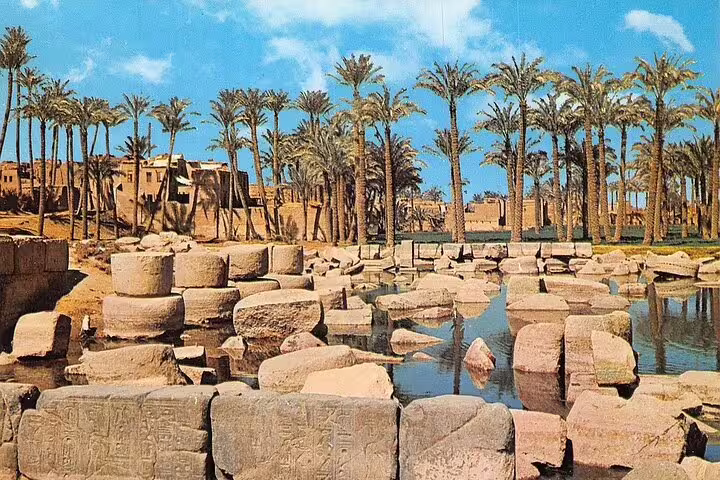 Memphis Egypt ruins with palm trees and ancient stone blocks, a highlight on Dahshur Pyramid tour