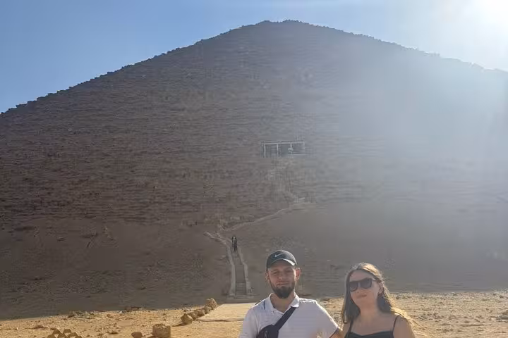 Travelers at Dahshur Red Pyramid entrance during private tour from Cairo to Saqqara, Memphis and Dahshur