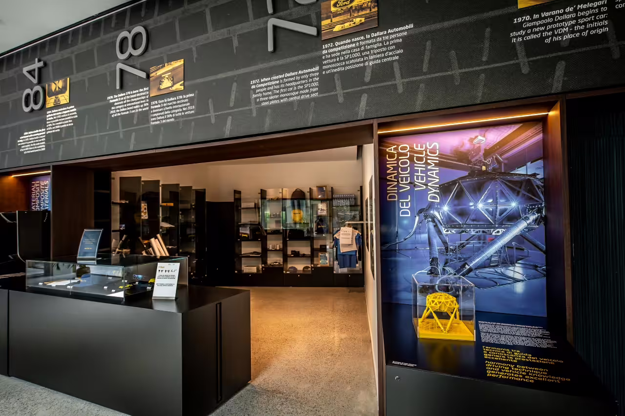 Explore vehicle dynamics and engineering excellence at Dallara Academy's interactive motorsport display in Parma.