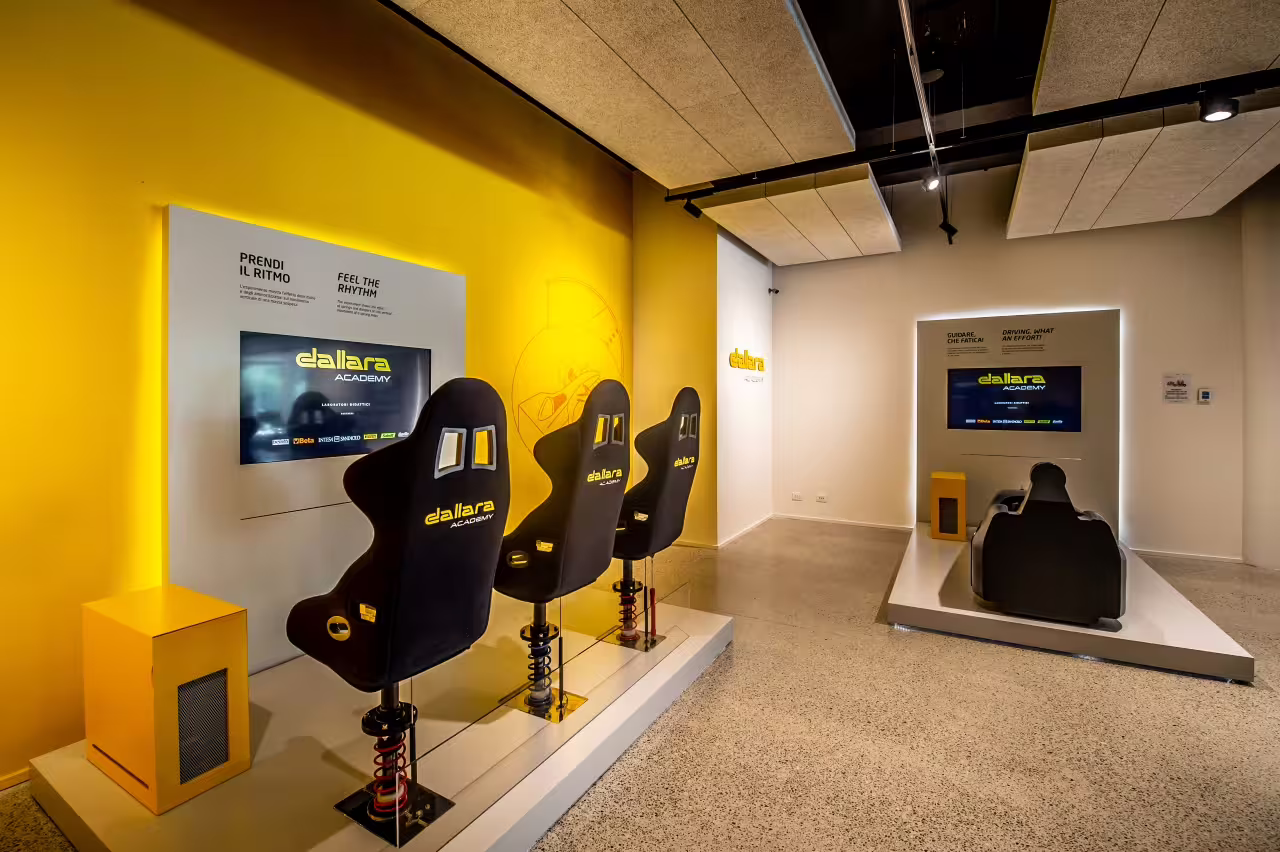 Simulator chairs at Dallara Academy, offering an immersive motorsport experience in Parma's renowned facility.