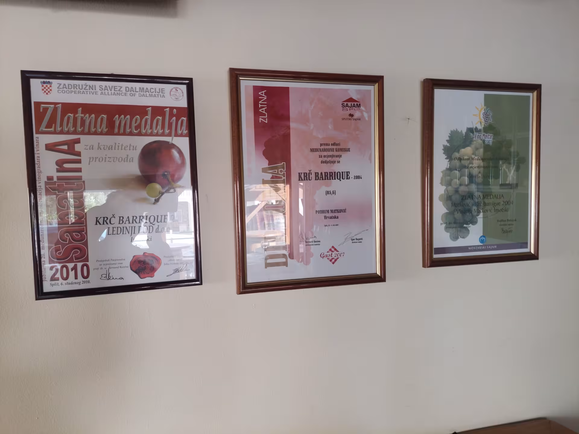 Award certificates for Dalmatian wine at an Imotski winery stop on the Split Hidden Gems wine and dine tour