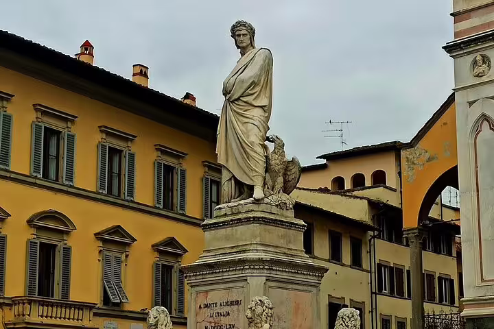 Statue of Dante Alighieri in a historic Florence square, featured on private Livorno shore excursion with city tour