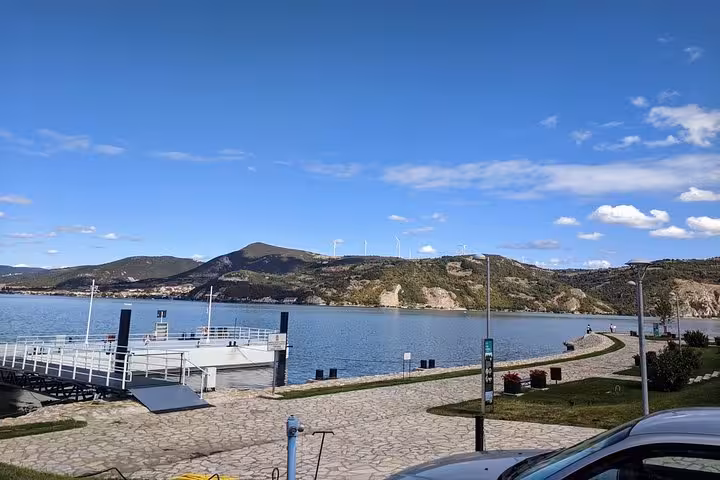 Picturesque dockside view of the Danube River and surrounding hills on the Golubac Fortress day trip.