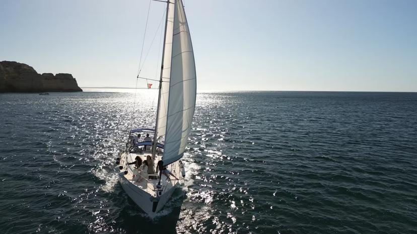 Daytime sailing adventure near Lagos and Luz with a yacht cruising the Algarve coast on sparkling Atlantic waters