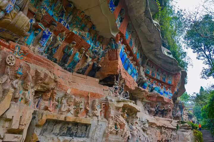 Intricate Buddhist carvings and sculptures at Dazu Rock Carvings site, showcasing ancient artistry near Chongqing.