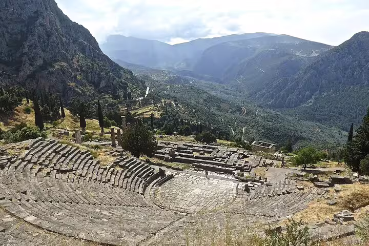Ancient amphitheater of Delphi overlooking a stunning mountainous landscape on a private Athens tour.