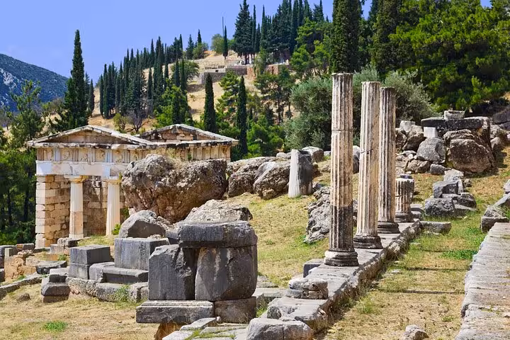 Ancient Delphi ruins with stone columns and treasuries on Mount Parnassus, visited on a private Athens day tour