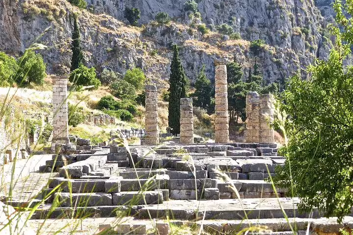 Explore the ancient ruins of Delphi surrounded by lush greenery on a 4-day classical private tour from Athens.