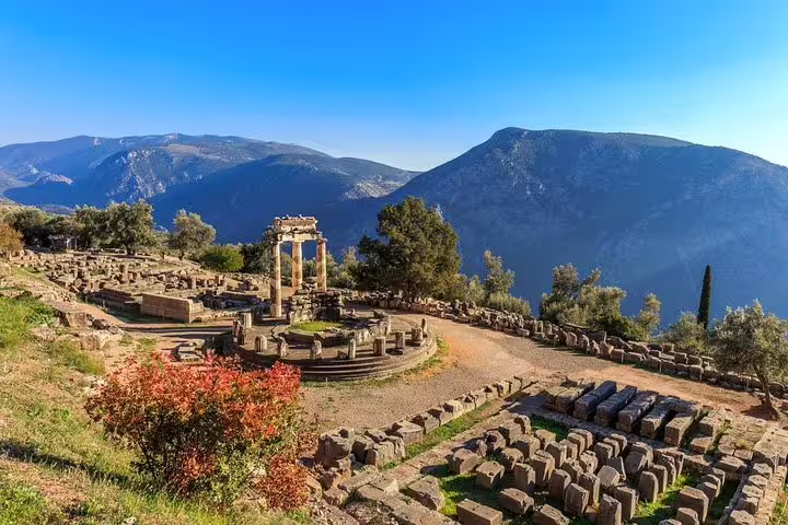 Breathtaking view of the ancient ruins at Delphi with majestic mountains in the background, perfect for a private day trip from Athens.