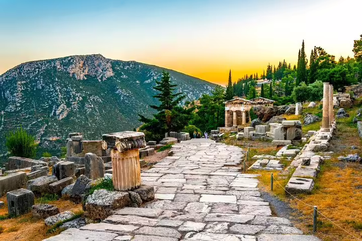 Ancient stone path in Delphi archaeological site at sunset, highlight of Delphi and Thermopylae day tour