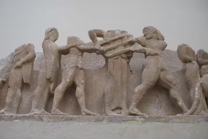 Delphi archaeological frieze sculpture scene at the museum, seen on a private day trip from Athens to Delphi